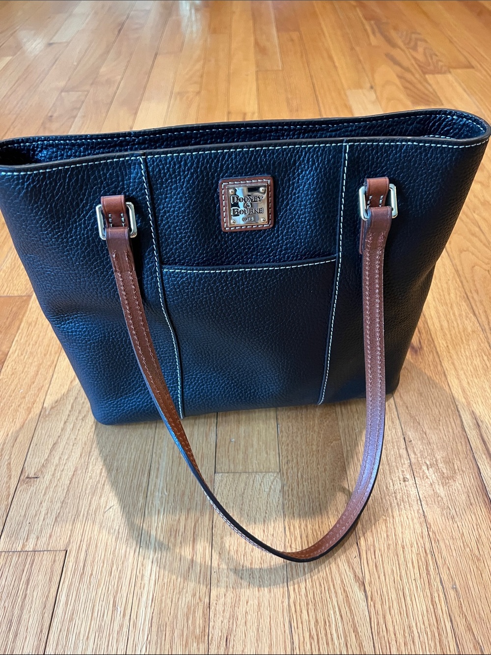 Dooney & Bourke Black Pebbled Leather Tote with Brown Straps and Brass Plaque